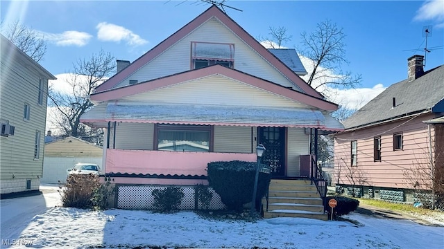 view of front facade with a garage and an outdoor structure