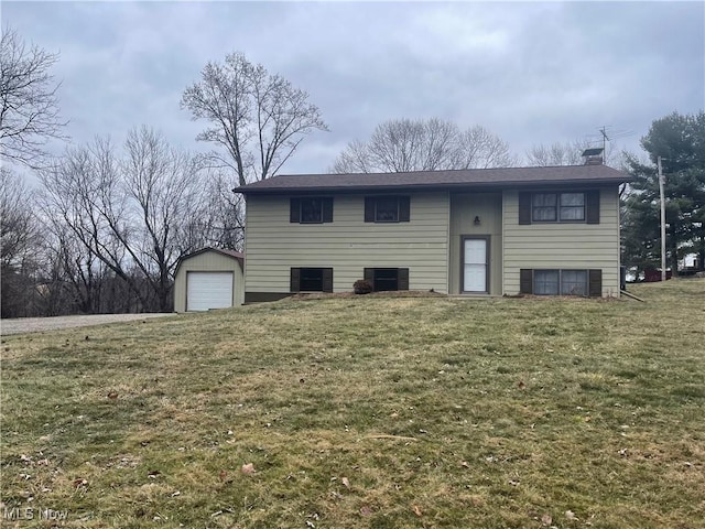 rear view of house featuring an outbuilding, a garage, and a yard