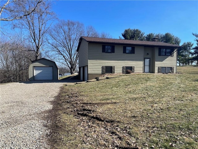 bi-level home featuring a garage, an outdoor structure, central AC, and a front lawn