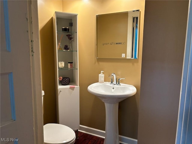 420 N 14th St, Cambridge, OH 43725 - half bath with wood finished floors, toilet, and baseboards