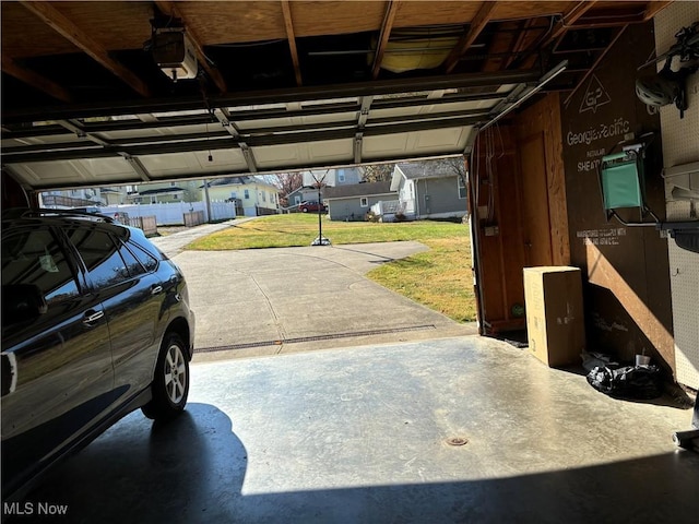 garage featuring a yard