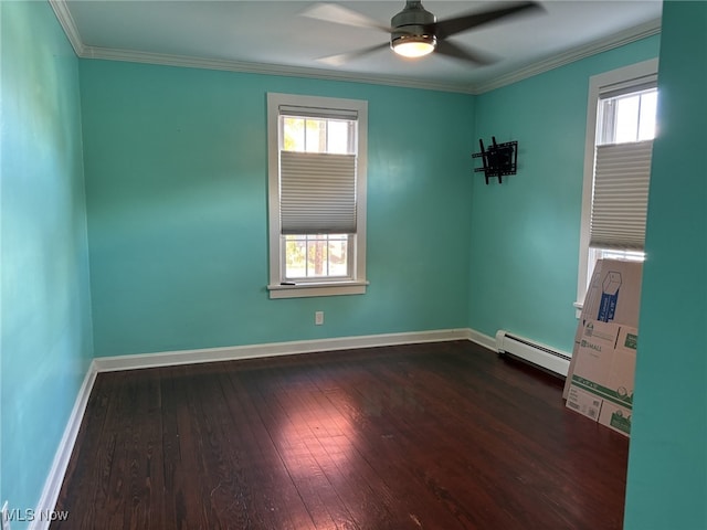 420 N 14th St, Cambridge, OH 43725 - empty room with baseboard heating, dark wood finished floors, healthy amount of natural light, a ceiling fan, and crown molding