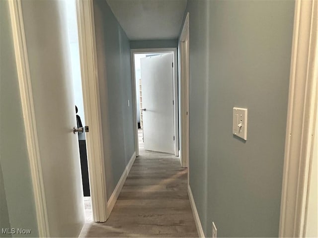 corridor featuring dark wood-type flooring