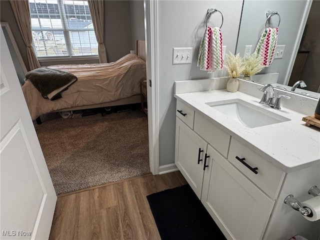 bathroom featuring vanity and hardwood / wood-style floors