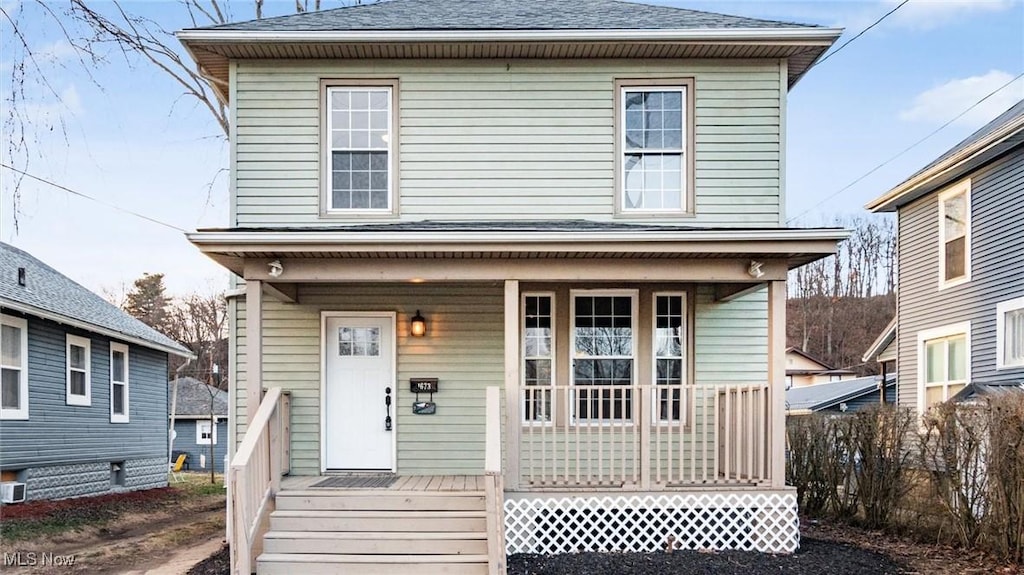 view of property with a porch