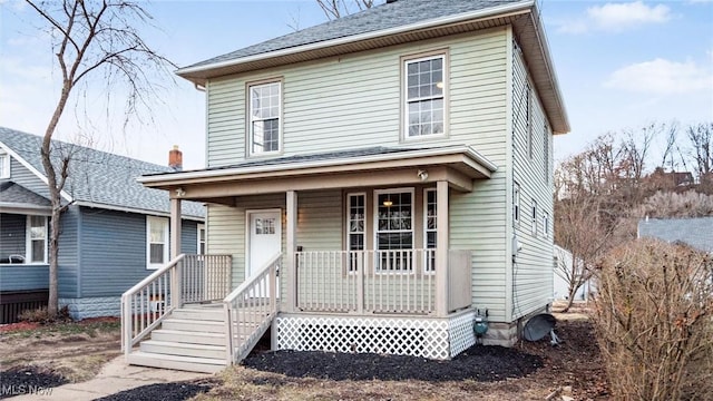 view of property featuring a porch