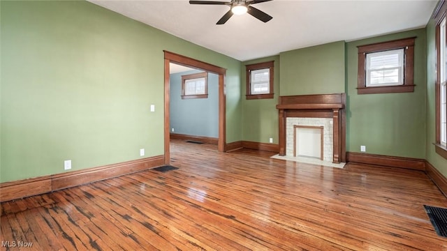 unfurnished living room with ceiling fan and light hardwood / wood-style flooring