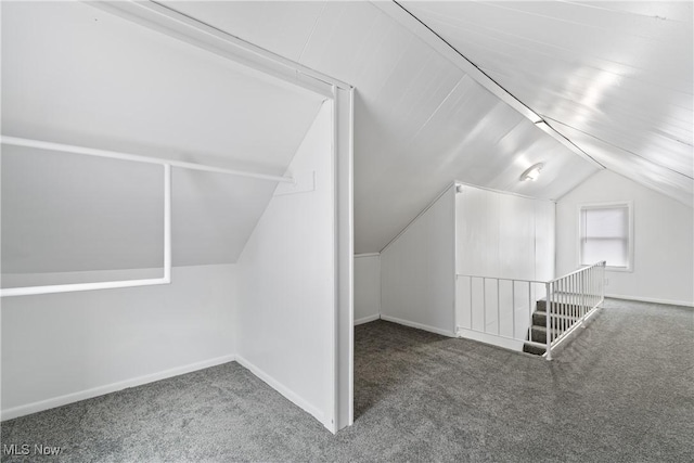 bonus room featuring carpet and lofted ceiling