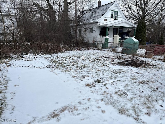 view of yard layered in snow