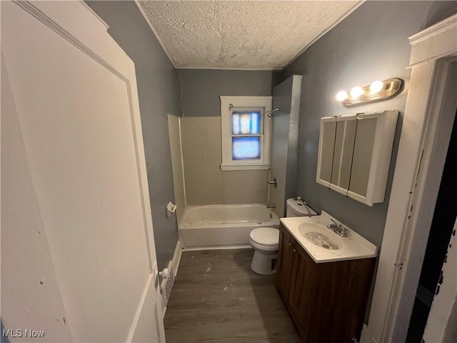 full bathroom with toilet, wood-type flooring, a textured ceiling, shower / tub combination, and vanity