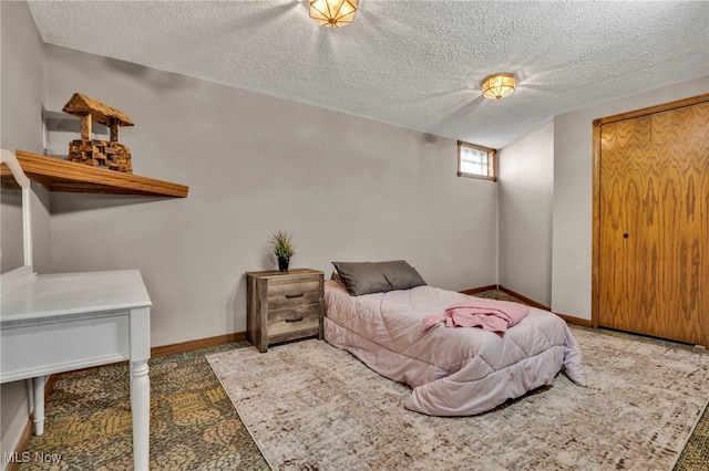 bedroom featuring a textured ceiling