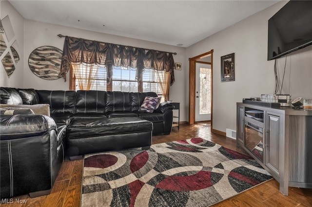 living room featuring dark hardwood / wood-style flooring