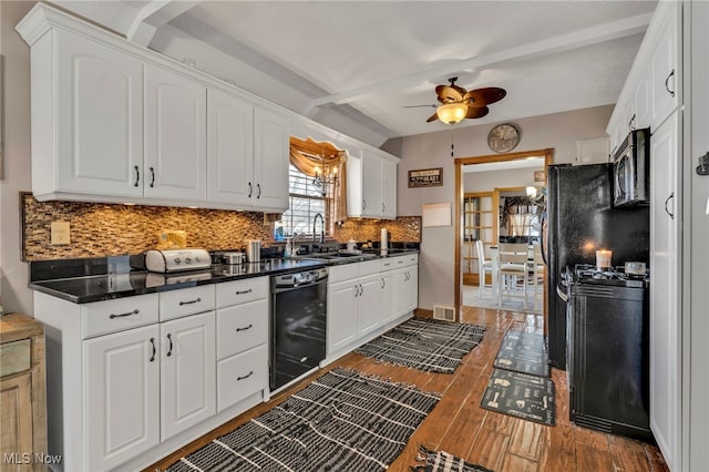 kitchen featuring sink and white cabinets