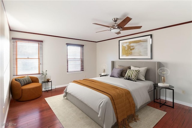 bedroom featuring crown molding, ceiling fan, and dark hardwood / wood-style flooring