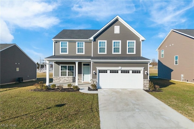 view of front of home featuring a garage, covered porch, and a front yard