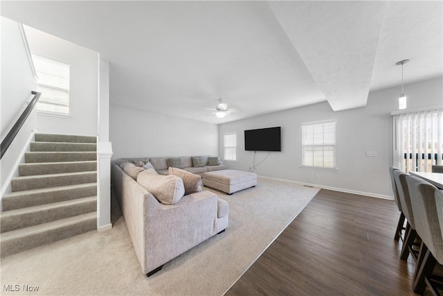 living room featuring ceiling fan and wood-type flooring