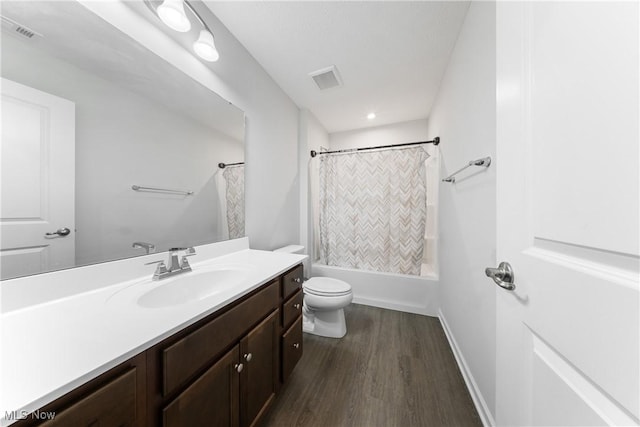 full bathroom with shower / bath combination with curtain, vanity, toilet, and wood-type flooring