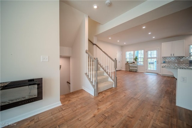 unfurnished living room featuring light wood-type flooring