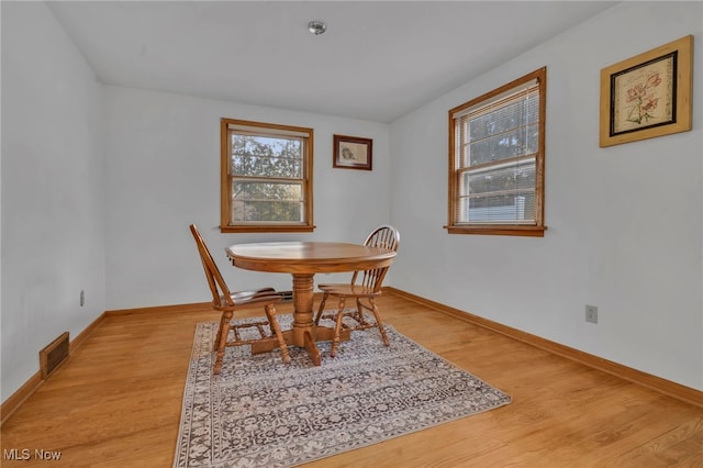 dining area with light wood-type flooring