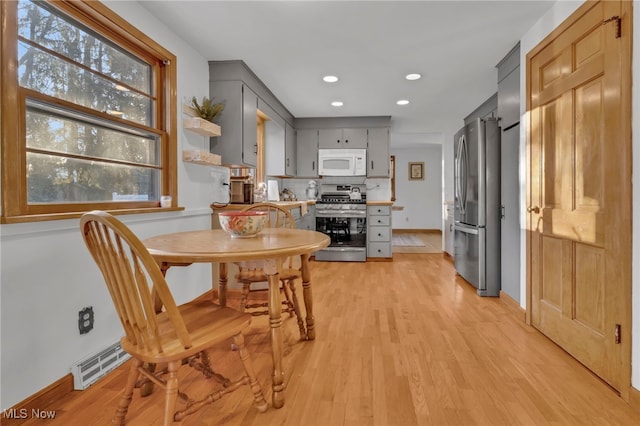 dining area with light wood-type flooring