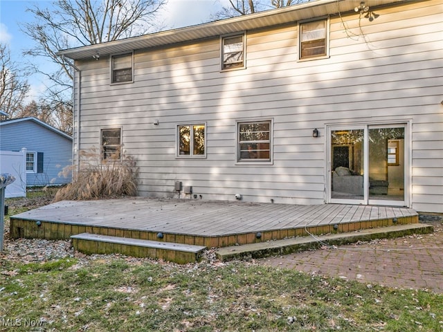 rear view of property with a wooden deck