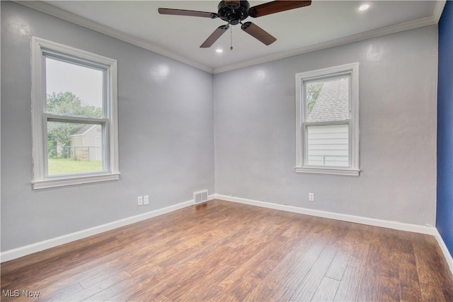 unfurnished room with crown molding, ceiling fan, and hardwood / wood-style floors