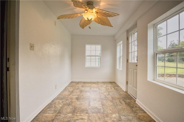 interior space featuring ceiling fan