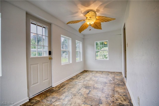 entryway featuring ceiling fan