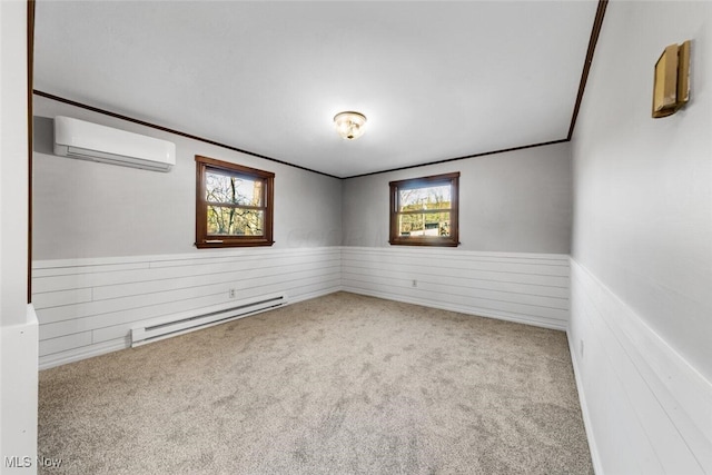 carpeted empty room with ornamental molding, wainscoting, a wall mounted AC, and baseboard heating