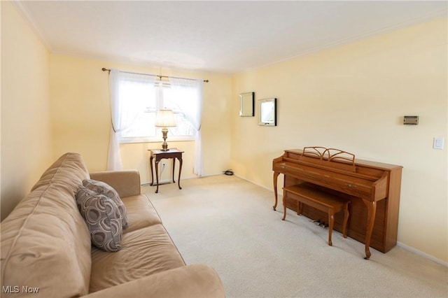 carpeted living room featuring ornamental molding