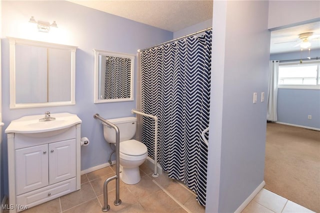 bathroom featuring tile patterned floors, toilet, a textured ceiling, vanity, and ceiling fan