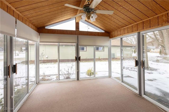 unfurnished sunroom with wood ceiling, ceiling fan, and lofted ceiling