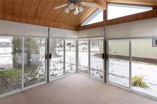 unfurnished sunroom featuring wood ceiling, lofted ceiling with beams, and ceiling fan