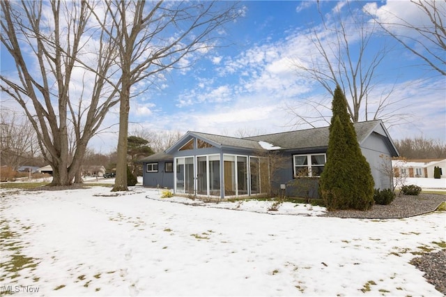 exterior space featuring a sunroom