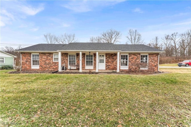 single story home with covered porch and a front lawn