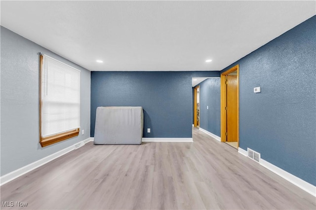 unfurnished room featuring light wood-type flooring