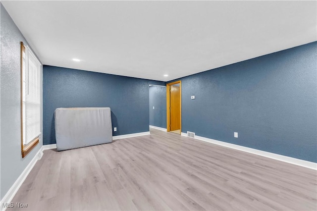 empty room featuring light hardwood / wood-style floors