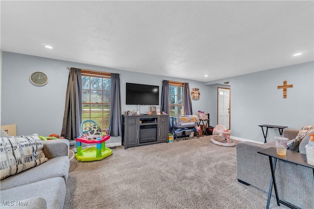 carpeted living room featuring a wealth of natural light