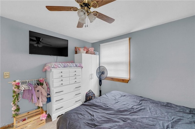 bedroom featuring ceiling fan