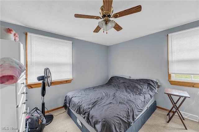 carpeted bedroom featuring ceiling fan