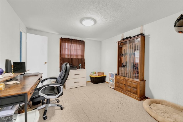 office area with a textured ceiling