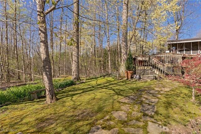 30700 Ainsworth Dr, Pepper Pike, OH 44124 - view of yard with stairway, a deck, and a sunroom