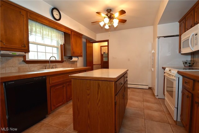 kitchen featuring sink, decorative backsplash, a baseboard heating unit, a center island, and white appliances