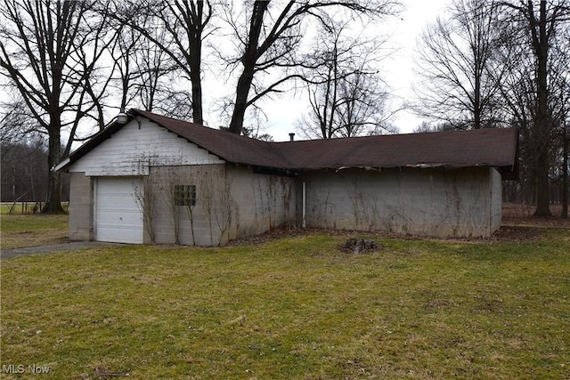 view of outdoor structure with a lawn