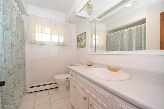 bathroom featuring tile patterned flooring, vanity, toilet, and baseboard heating