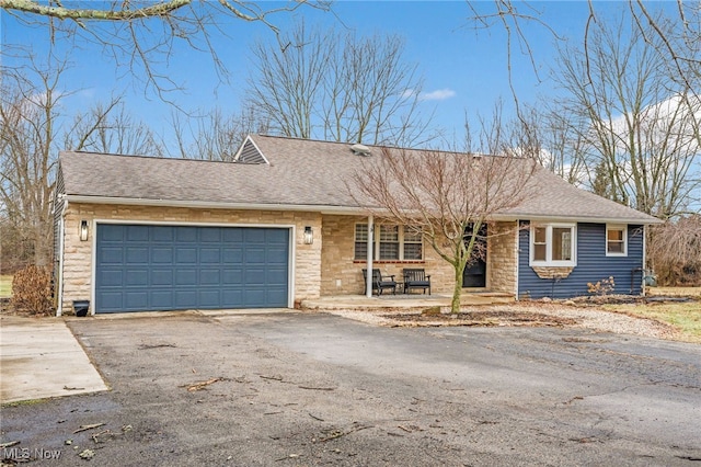 ranch-style home with a garage