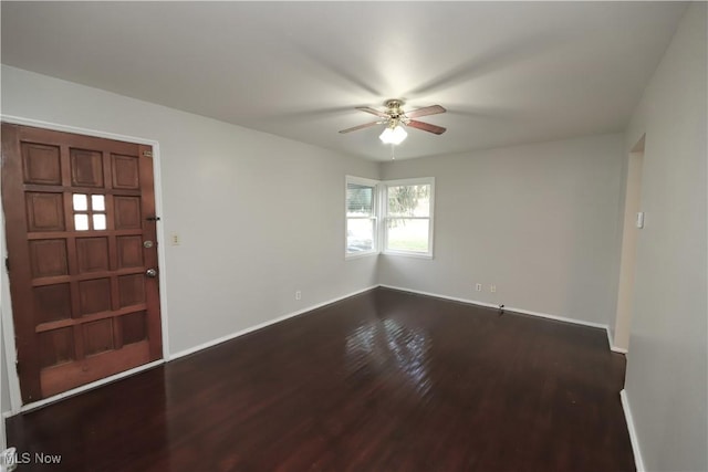 entryway with dark wood-type flooring and ceiling fan