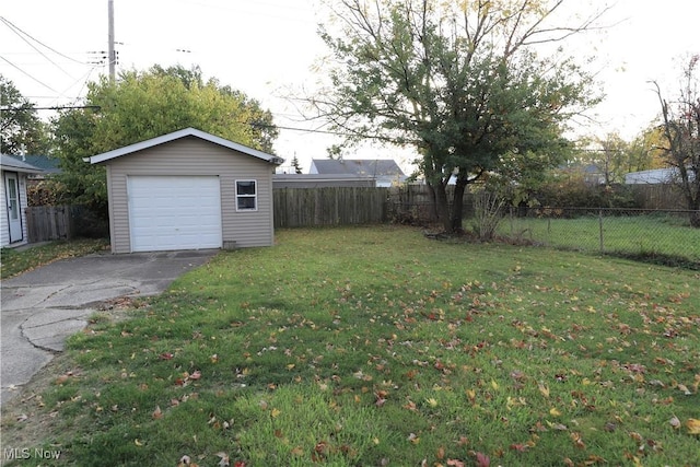 view of yard featuring an outbuilding and a garage