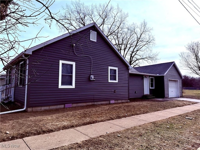 view of property exterior featuring a garage