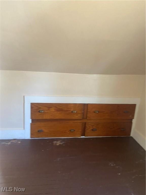 additional living space featuring baseboards